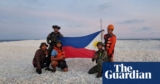 China and Philippines show competing flags on disputed South China Sea sandbank | China